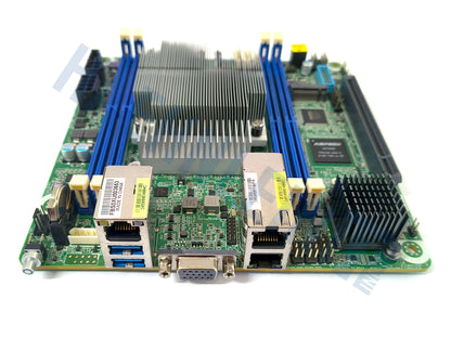 A green Asrock Rack EPYC3451D412-2T motherboard with blue RAM slots, a large silver heatsink, close-up of various ports, on a white background.
