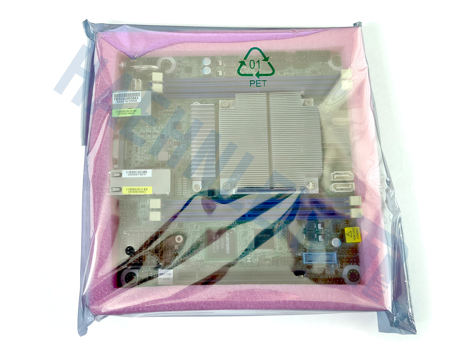 A green Asrock Rack EPYC3451D412-2T motherboard inside a pink protective foam insert, wrapped in a clear antistatic bag with a green PET recycling symbol printed on the front, set against a plain white background.