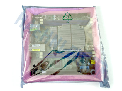 A green Asrock Rack EPYC3451D412-2T motherboard inside a pink protective foam insert, wrapped in a clear antistatic bag with a green PET recycling symbol printed on the front, set against a plain white background.