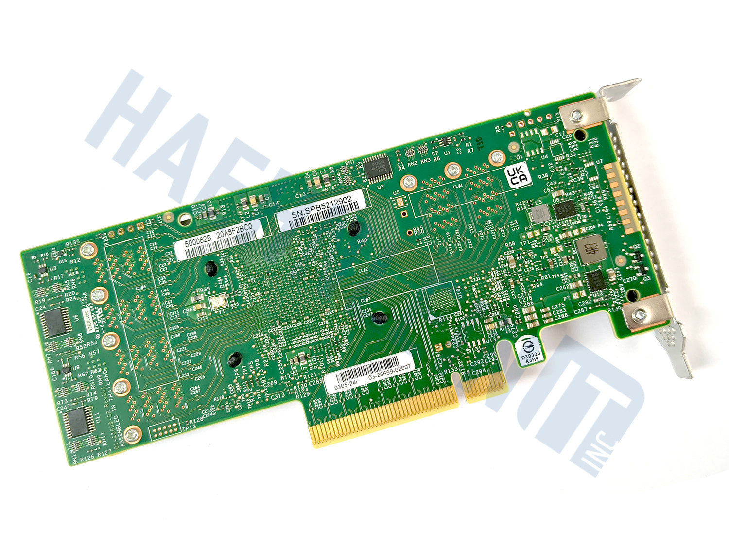 The backside of a Broadcom 9305-24i PCIe card: A green circuit board with various stickers with barcodes, and a gold PCI Express connector, shown with a low profile slot bracket on a white background with a faint HaehnleinIT Inc. watermark.